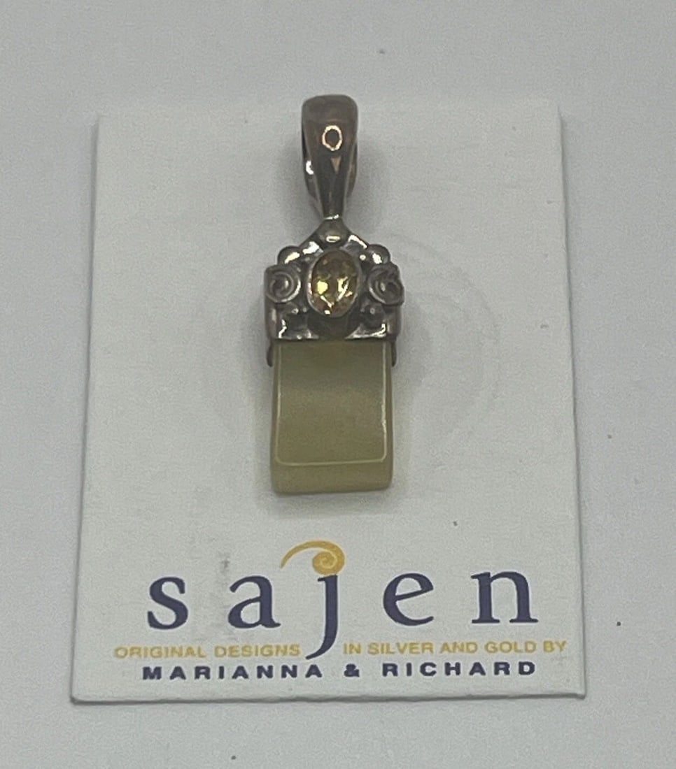 SAJEN STERLING SILVER & MOONSTONE PENDANT: SAJEN STERLING SILVER & MOONSTONE PENDANT This beautiful pendant from Sajen is a must-have for any jewelry collection. Crafted from high-quality 925 sterling silver, it features a stunning moonstone a