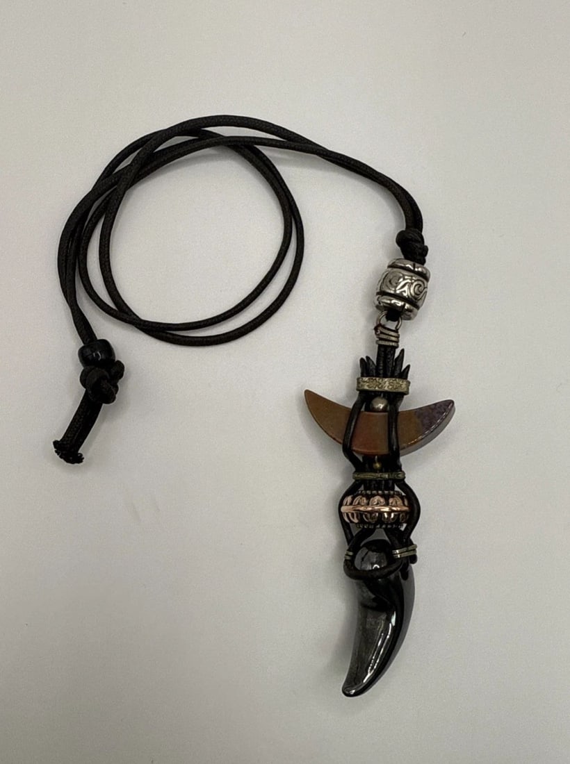 WOLF OR CANINE TOOTH PENDANT ON LONG CORD NECKLACE (1 of 2)
