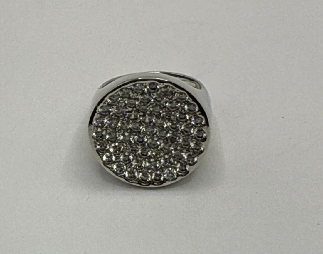 STERLING SILVER & COLORLESS STONE CIRCLE RING SIZE 6: STERLING SILVER & COLORLESS STONE CIRCLE RING SIZE 6 This sterling silver and colorless stone circle ring in size 6 is a delicate and elegant piece of fine jewelry. The 925 sterling silver purity ensu