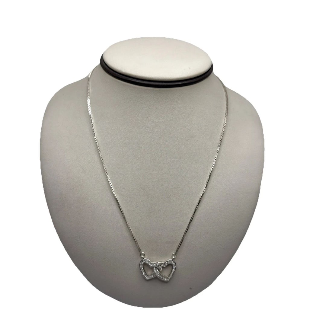 ANN KLEIN INTERLOCKING HEART ADJUSTABLE NECKLACE WITH COLORLESS STONES: ANN KLEIN INTERLOCKING HEART ADJUSTABLE NECKLACE WITH COLORLESS STONES Crafted with an eye for elegance, the Anne Klein Interlocking Heart Adjustable Necklace is a charming addition to any jewelry col
