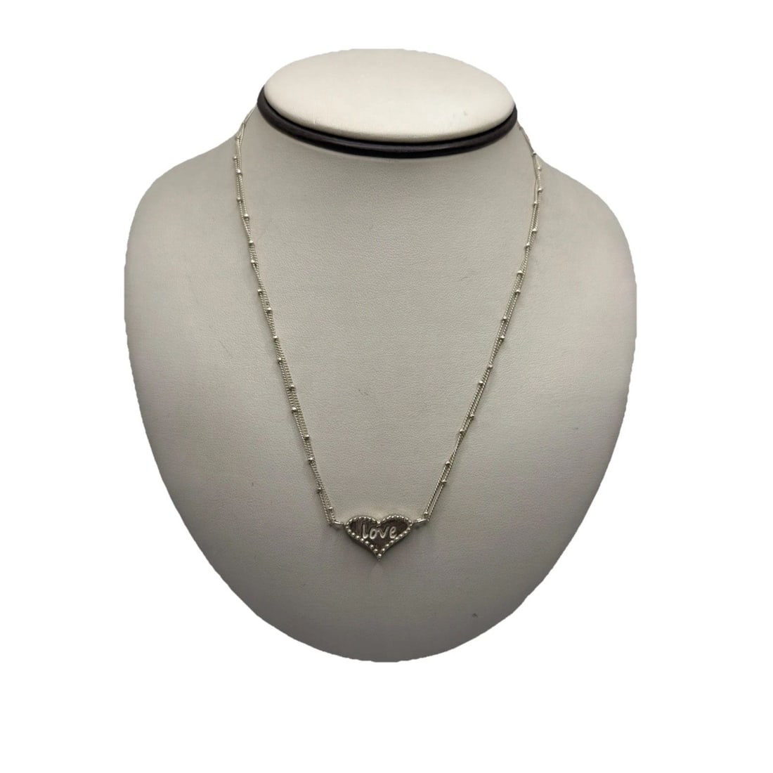 SOPHIA & CHLOE ADJUSTABLE INSCRIBED HEART NECKLACE: SOPHIA & CHLOE ADJUSTABLE INSCRIBED HEART NECKLACE Crafted by Sophia & Chloe, this charming necklace features a unique heart pendant with beaded accents that exude a timeless elegance. The adjustable