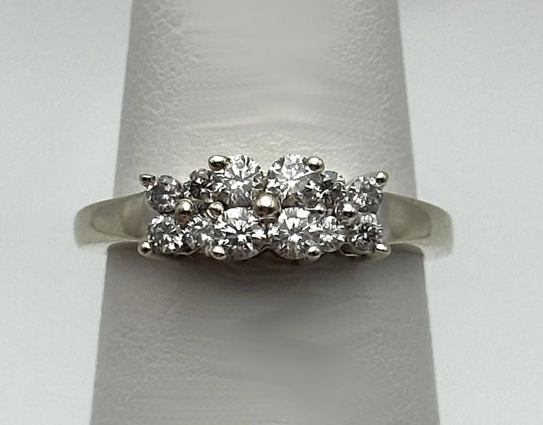 14K WHITE GOLD RING WITH A UPPER CLUSTER OF DIAMONDS 0.52CTS SIZE: 6.5: 14k White Gold Ring with a Upper Cluster of Diamonds 0.52cts Condition: Used Material: 14k White Gold Ring Size: 6.5 Weight: 3.4 grams Top Width: 5.2mm Bottom Width: 1.2mm Stone Info: Diamonds are