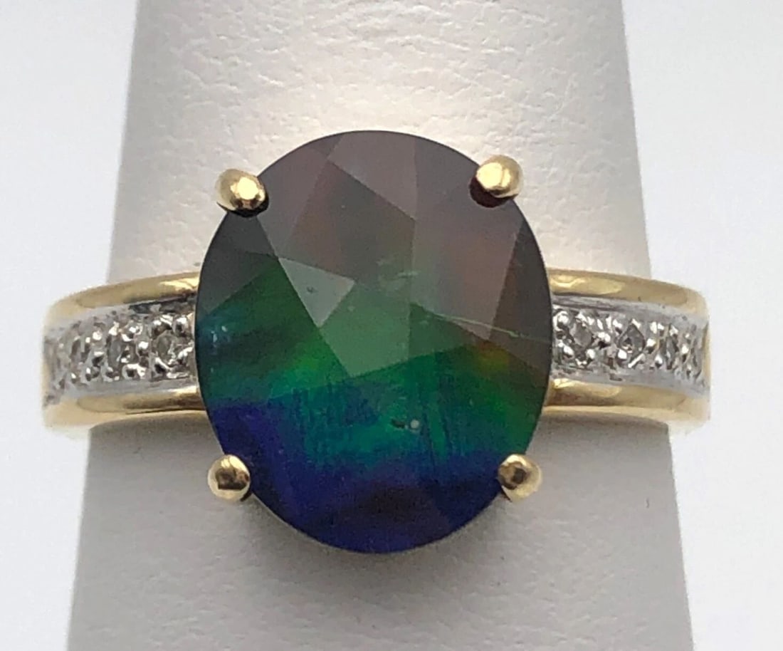 18K GOLD RING WITH AMMOLITE AND 0.04CTS OF DIAMONDS SIZE: 7 4.1G: 18K GOLD RING WITH AMMOLITE AND 0.04CTS OF DIAMONDS SIZE: 7 18k Gold Ring with Ammolite and 0.04cts of Diamonds Condition: Used Material: 18k Yellow Gold Ring Size: 7 Weight: 4.1 grams Top Width: