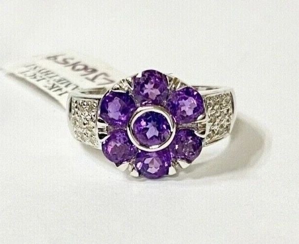 14K WHITE GOLD FLOWER RING WITH AMETHYST AND 0.15CTS OF DIAMONDS SIZE: 7 5G: WOMEN'S 14K WHITE GOLD FLOWER RING WITH AMETHYST AND 0.15CTS DIAMONDS (SIZE 7) Women's 14k White Gold Flower Ring with Amethyst and 0.15CTS Diamonds (Size 7) You are bidding on a new with tags