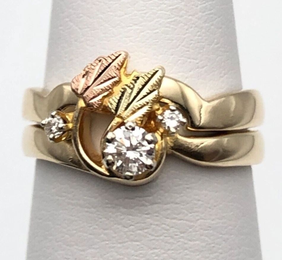 10K GOLD SET OF RINGS WITH 12K LEAFY ACCENTS AND 0.20CTS OF DIAMONDS SIZE: 6.25 (1 of 2)