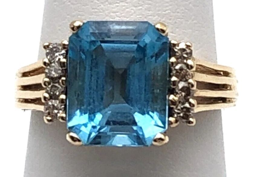 14K GOLD RING WITH CENTER BLUE TOPAZ AND 0.13CTS DIAMONDS SIZE: 6 (1 of 2)