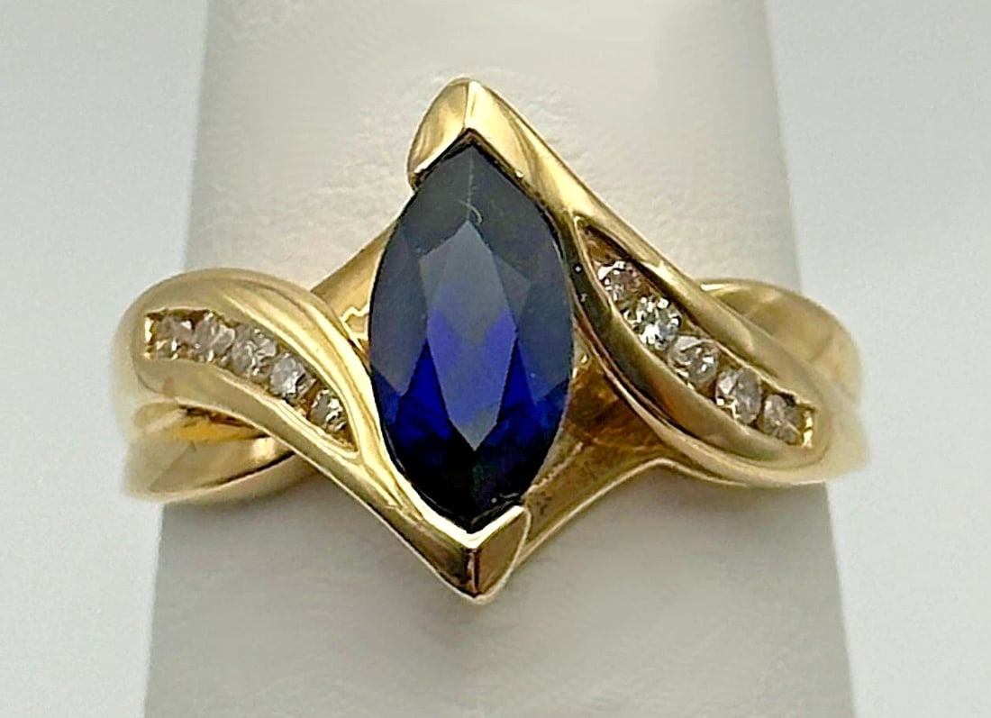 10K GOLD RING WITH LAB CREATED SAPPHIRE AND 0.12CTS OF NATURAL DIAMONDS SIZE: 7 (1 of 2)