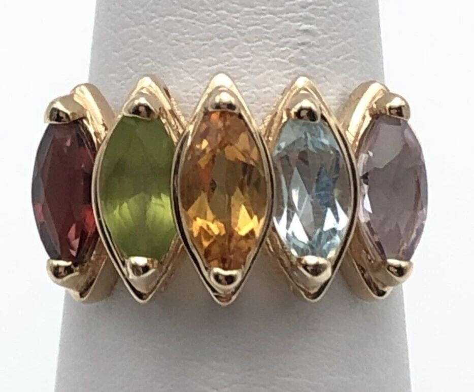 14K GOLD MOTHERS RING SET WITH AMETHYST, PERIDOT, CITRINE, BLUE TOPAZ, GARNET: 14K GOLD MOTHERS RING SET WITH AMETHYST, PERIDOT, CITRINE, BLUE TOPAZ, GARNET 14k Gold Mothers Ring set with Amethyst, Peridot, Citrine, Blue Topaz, Garnet You are bidding on a 14k Gold Mothers Ring s