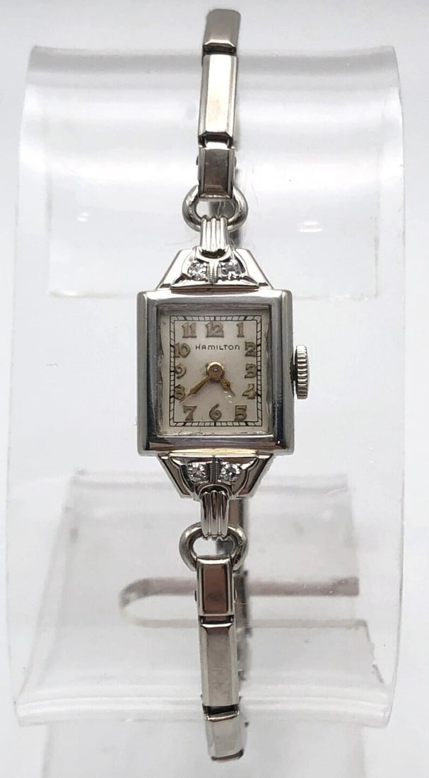 14K WHITE GOLD HAMILTON WOMAN'S WATCH WITH 0.08CTS DIAMONDS: 14K WHITE GOLD HAMILTON WOMAN'S WATCH WITH 0.08CTS DIAMONDS 14k White Gold Hamilton Woman's Watch with 0.08cts Diamonds Condition: Used. Movement is running. Material: Case is solid14k White Gold (wei