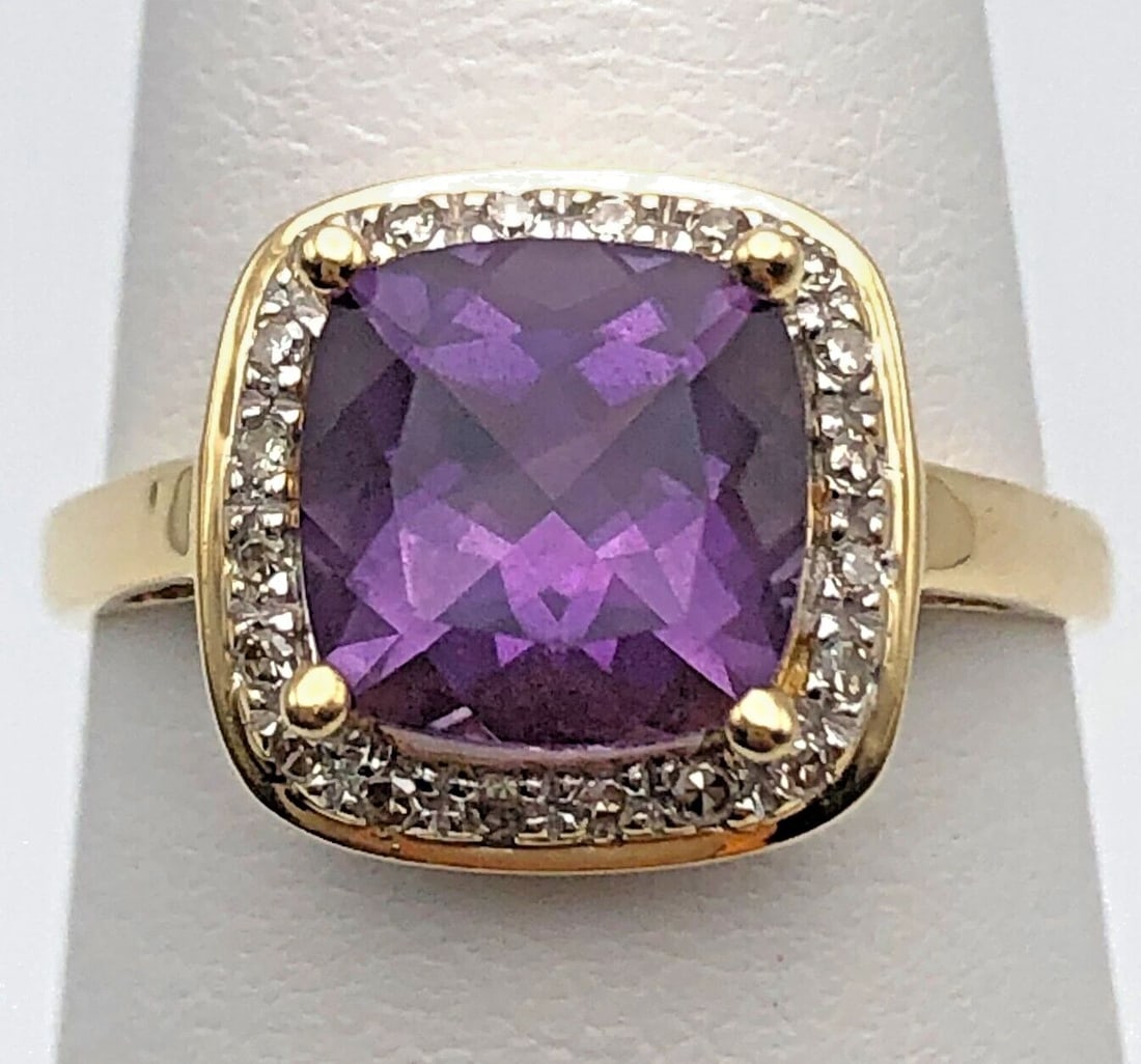 14K GOLD RING SET WITH CUSHION AMETHYST AND 0.25CTS OF DIAMONDS SIZE: 7: 14K GOLD RING SET WITH CUSHION AMETHYST AND 0.25CTS OF DIAMONDS SIZE: 7 14k Gold Ring set with center Amethyst and 0.25cts of Diamonds Condition: Used, Display model Material: 14k Yellow Gold Ring Siz
