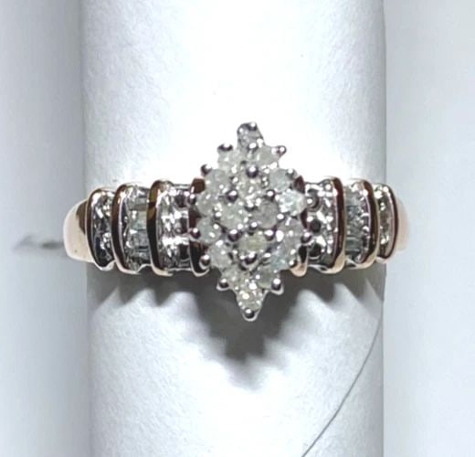 10K ROSE GOLD MARQUISE SHAPED RING WITH 0.25CTS OF DIAMONDS SIZE: 7.25 3.4G: WOMEN'S 10K ROSE GOLD RING WITH 0.25CT DIAMONDS (SIZE 7.25) Women's 10K Rose Gold Ring with 0.25CT Diamonds (Size 7.25) You are bidding on a new with tags Women's 10K Rose Gold Ring with 0.25CT Diamon