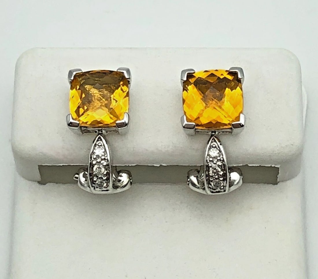 14K WHITE GOLD EARRINGS WITH CITRINE AND 0.06CTS OF DIAMONDS 3.4G OMEGA BACKS: 14K WHITE GOLD EARRINGS WITH CITRINE AND 0.06CTS OF DIAMONDS 3.4G OMEGA BACKS 14k White Gold Earrings with Citrine and 0.06cts of Diamonds Condition: Used, have been cleaned Material: 14k White Gold W