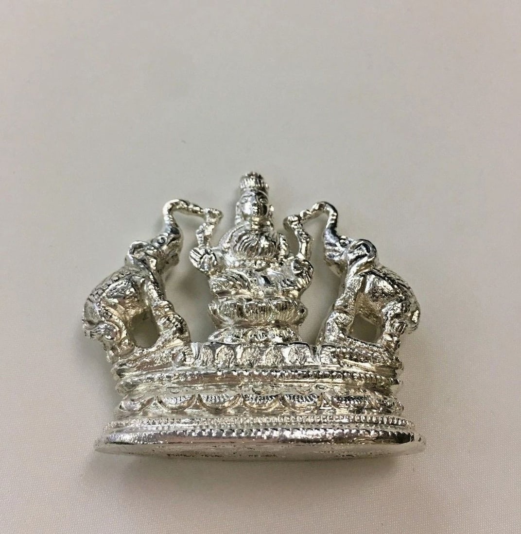 STERLING SILVER LAXMI FIGURE WITH ELEPHANTS: STERLING SILVER LAXMI FIGURE WITH ELEPHANTS Sterling Silver Laxmi Figure with Elephants You are bidding on a Sterling Silver Laxmi Figure with Elephants. There are scratches on the figure from wear an