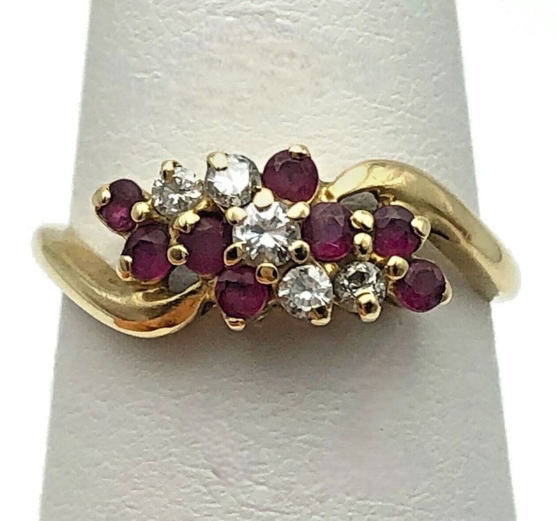14K GOLD CLUSTER RING WITH NATURAL RUBIES AND 0.14CTS OF DIAMONDS SIZE: 7: 14K GOLD CLUSTER RING WITH NATURAL RUBIES AND 0.14CTS OF DIAMONDS SIZE: 7 14k Gold Ring Cluster with natural Rubies and 0.14cts of Diamonds Condition: Used, has been inspected Material: 14k Yellow Gol