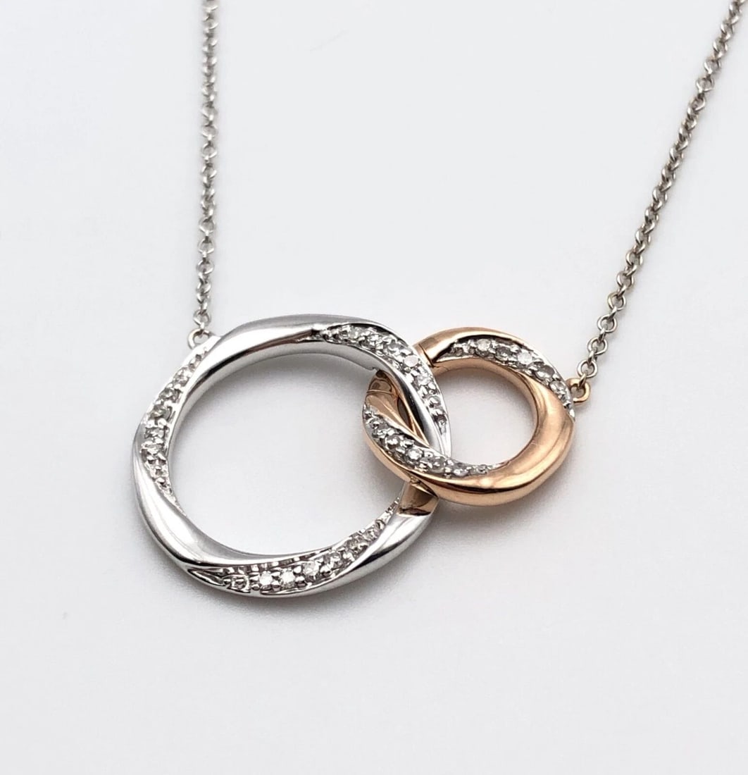 MIRACLE LINKS 10K TWO TONE WHITE/ROSE GOLD NECKLACE WITH 0.16CTS DIAMONDS 19": MIRACLE LINKS 10K TWO TONE WHITE/ROSE GOLD NECKLACE WITH 0.16CTS DIAMONDS 19" Miracle Links 10k two tone white/rose gold Necklace with 0.16cts Diamonds 19" You are bidding on a Miracle Links 10k two t