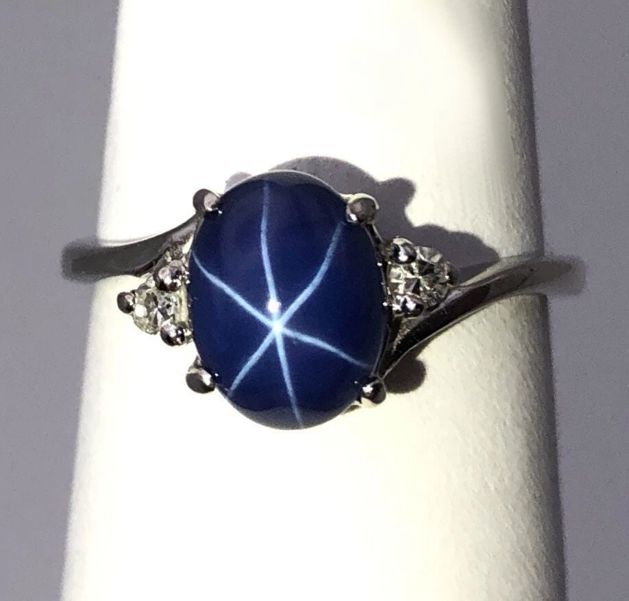 10K WHITE GOLD RING WITH SYNTHETIC STAR SAPPHIRE AND DIAMONDS SIZE: 4.75: 10K WHITE GOLD RING WITH SYNTHETIC STAR SAPPHIRE AND DIAMONDS SIZE: 4.75 10k White Gold Ring with Synthetic Star Sapphire and Diamonds You are bidding on a 10k White Gold Ring with Synthetic Star Sapp