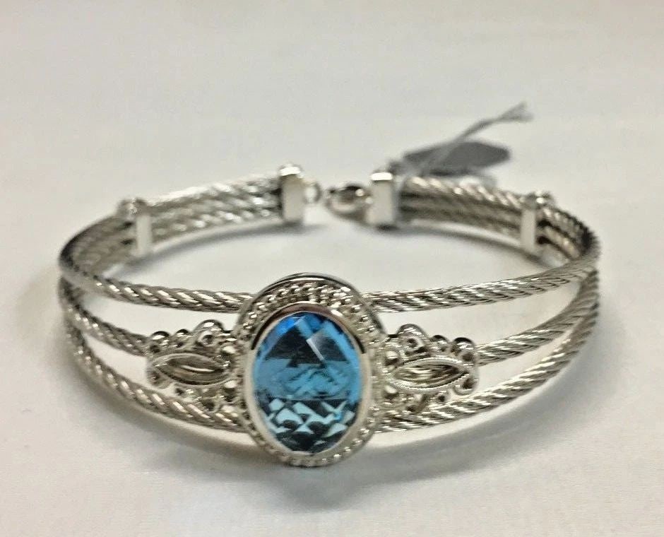 GABRIEL & CO 925 SILVER AND STEEL SO86705 CUFF/BANGLE WITH BLUE TOPAZ: GABRIEL & CO 925 SILVER AND STEEL SO86705 CUFF/BANGLE WITH BLUE TOPAZ Gabriel & Co 925 silver and steel SO86705 Cuff/Bangle with blue topaz You are bidding on a Gabriel & Co 925 silver and steel cuff/