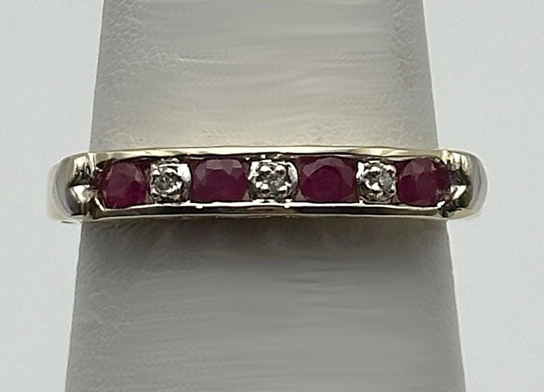 10K GOLD LOVE HEART STYLE BAND WITH NATURAL RUBIES AND 0.02CTS OF DIAMONDS (1 of 2)