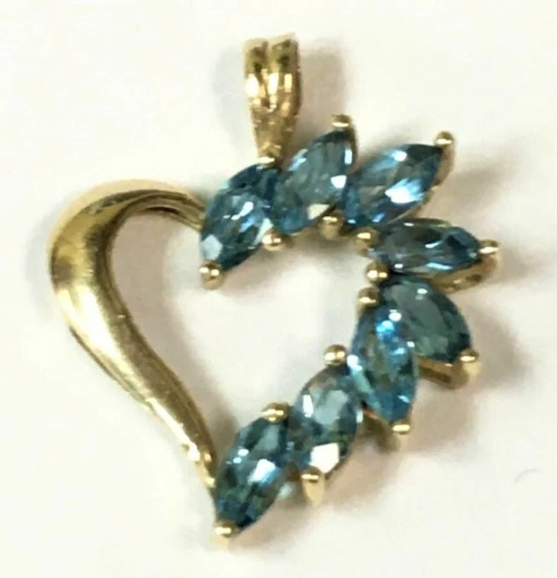 10K YELLOW GOLD HEART PENDANT WITH EIGHT MARQUISE CUT BLUE TOPAZ: 10K YELLOW GOLD HEART PENDANT WITH BLUE TOPAZ 10k Yellow Gold Heart Pendant with Blue Topaz You are bidding on a pre-owned 10k Yellow Gold Heart Pendant with Blue Topaz. The pendant has marks scratche