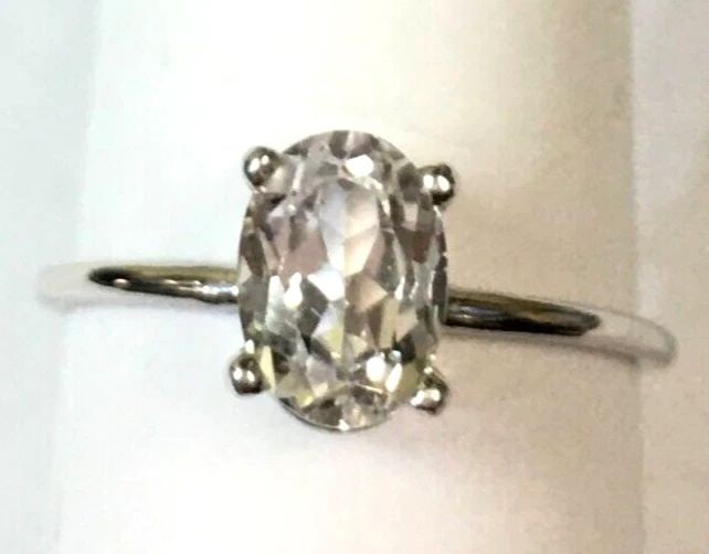 14K WHITE GOLD WOMAN'S RING WITH OVAL 7MM WHITE SAPPHIRE SIZE: 4.25 1.2G (1 of 2)