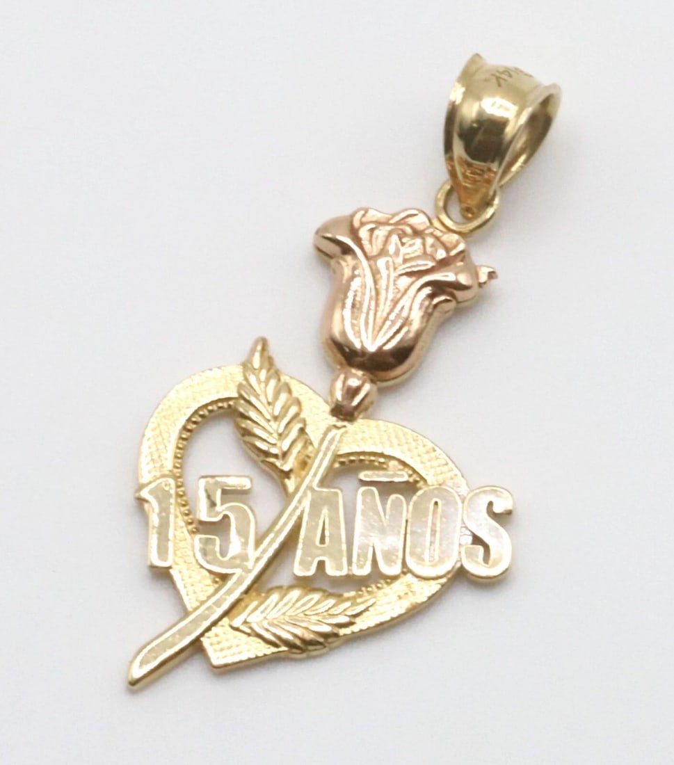 14K 2 TONE YELLOW/ROSE GOLD HEART PENDANT 15 ANOS / YEARS: 14K 2 TONE YELLOW/ROSE GOLD HEART PENDANT 15 ANOS / YEARS 14k 2 tone Yellow/Rose Gold Heart Pendant 15 Anos / Years You are bidding on a 14k 2 tone Yellow/Rose Gold Heart Pendant 15 Anos / Years. The
