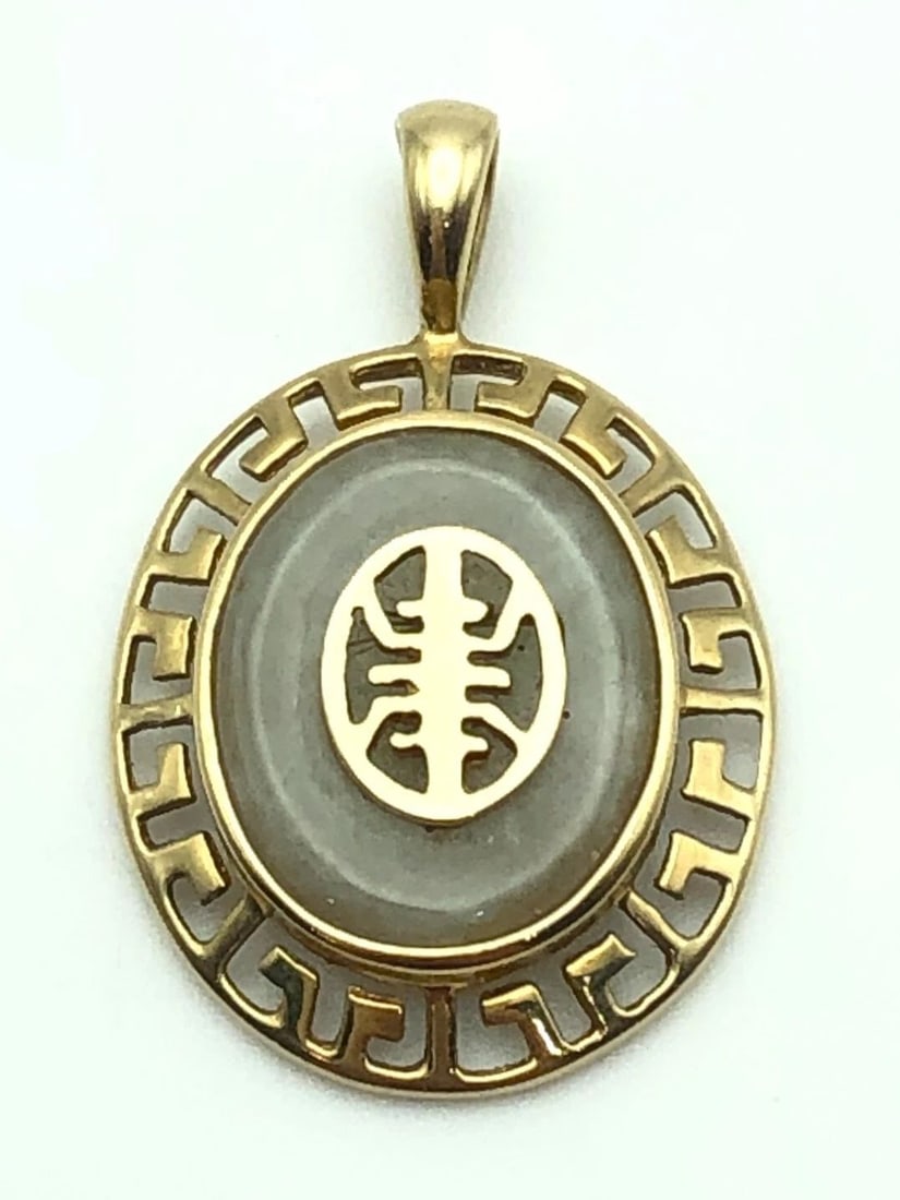 10K YELLOW GOLD OVAL SHAPED PENDANT WITH JADE 1.6 GRAMS (1 of 2)