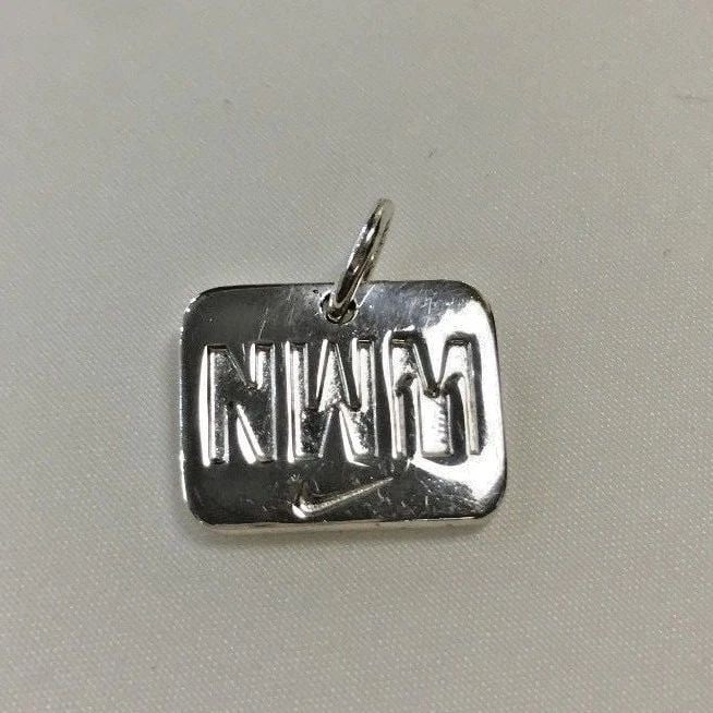 TIFFANY & CO. 2011 NIKE WOMEN'S MARATHON PENDANT: TIFFANY & CO. 2011 NIKE WOMEN'S MARATHON PENDANT Tiffany & Co. 2011 Nike Women's Marathon Pendant You are bidding on a pre-owned Tiffany & Co. 2011 Nike Women's Marathon Pendant. There are few minor s