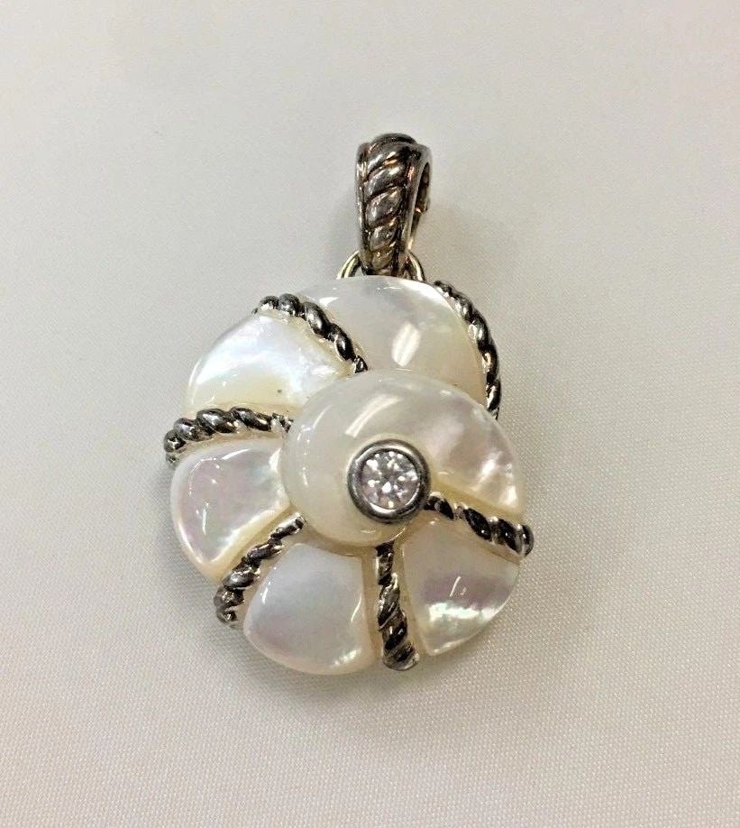 JUDITH RIPKA STERLING MOTHER OF PEARL DQCZ PENDANT: JUDITH RIPKA STERLING MOTHER OF PEARL DQCZ PENDANT Judith Ripka Sterling Mother of Pearl DQCZ Pendant You are bidding on a pre-owned Judith Ripka Sterling Mother of Pearl DQCZ Pendant. There are few m