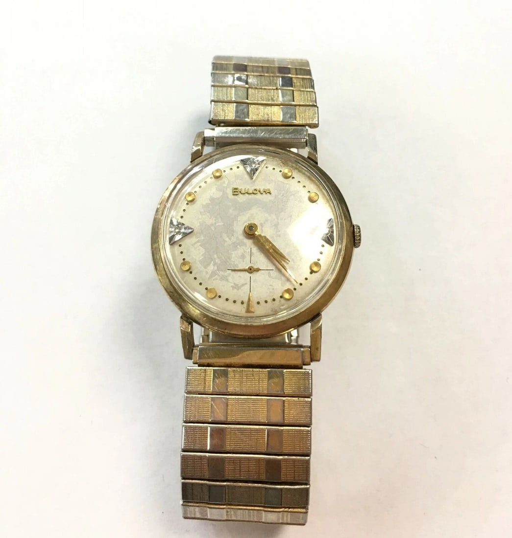 VINTAGE BULOVA 10K GOLD FILLED, STRETCH BAND WATCH: VINTAGE BULOVA 10K GOLD FILLED, STRETCH BAND WATCH Vintage Bulova 10k Gold Filled, Stretch Band Watch You are bidding on a pre-owned Vintage Bulova 10k Gold Filled, Stretch Band Watch. The watch has s