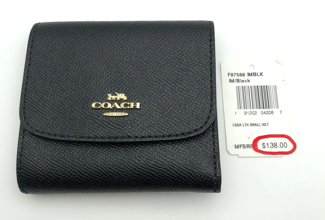 COACH IM/BLACK SMALL BUTTON CLASPING WALLET ( RETAIL $138.00 ): COACH IM/BLACK SMALL BUTTON CLASPING WALLET ( RETAIL $138.00 ) Coach IM/Black Small button clasping Wallet Condition: New with original Tag, NO box or papers Material: Genuine Leather Size: 4.5" x 4"