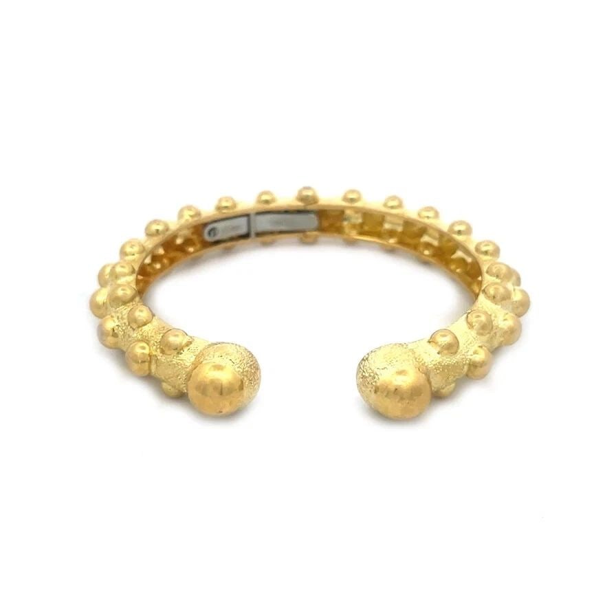 DAVID WEBB GOLD CUFF BRACELET 18K YELLOW HINGED FLEX DOME BAND: DAVID WEBB GOLD CUFF BRACELET 18K YELLOW HINGED FLEX DOME BAND DAVID WEBB GOLD CUFF BRACELET 18K YELLOW HINGED FLEX DOME BAND Elevate your jewelry collection with the timeless elegance of David Webb's