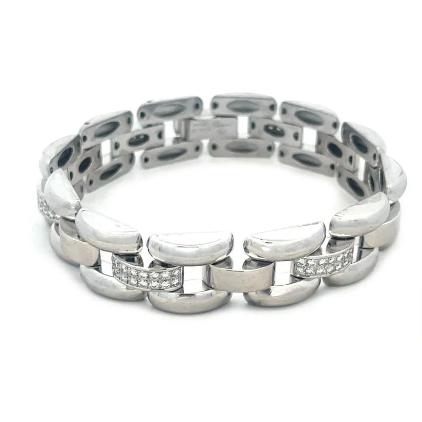 CHOPARD DIAMOND GOLD BRACELET 18K WHITE 3 ROWS CURVED BAR STYLE: CHOPARD DIAMOND GOLD BRACELET 18K WHITE 3 ROWS CURVED BAR STYLE CHOPARD DIAMOND GOLD BRACELET 18K WHITE 3 ROWS CURVED BAR STYLE This eye-catching gorgeous bracelet is by Chopard, a stunning display