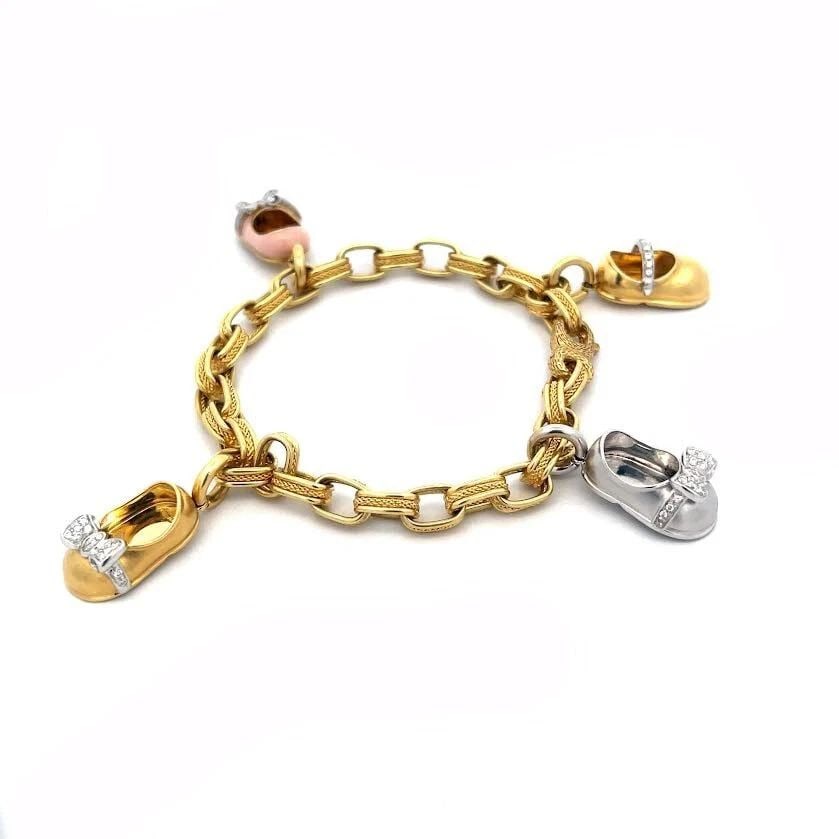 AARON BASHA 4 SHOE CHARM BRACELET 18K GOLD ENAMEL OVAL LINK: AARON BASHA 4 SHOE CHARM BRACELET 18K GOLD ENAMEL OVAL LINK AARON BASHA 4 SHOE CHARM BRACELET 18K GOLD ENAMEL OVAL LINK This is a charming 18k yellow gold chain bracelet features chasing oval links wi