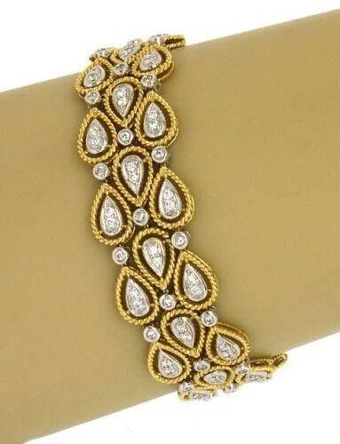 DIAMONDS GOLD BRACELET 18K TWO TONE 3 ROW PEAR SHAPE LINK WITH ROPE BORDER: DIAMONDS GOLD BRACELET 18K TWO TONE 3 ROW PEAR SHAPE LINK WITH ROPE BORDER This is a stunning 18k two-tone gold bracelet featuring a unique design of pear-shaped links with a rope border. The bracelet