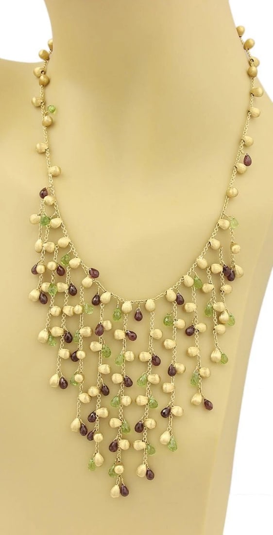 MARCO BICEGO PARADISE GOLD NECKLACE GEMSTONE 18K YELLOW FRINGE STYLE: MARCO BICEGO PARADISE GOLD NECKLACE GEMSTONE 18K YELLOW FRINGE STYLE This Marco Bicego Paradise Gold Necklace features a stunning fringe style design with red and green gemstones set in 18k yellow gol