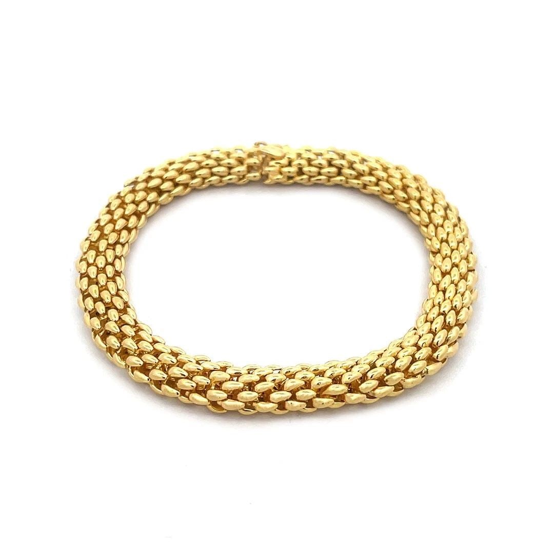 70252 CHAUMET PARIS GOLD MESH BRACELET 18K YELLOW TUBE FLEX LINK STYLE: 70252 CHAUMET PARIS GOLD MESH BRACELET 18K YELLOW TUBE FLEX LINK STYLE 70252 CHAUMET PARIS GOLD MESH BRACELET 18K YELLOW TUBE FLEX LINK STYLE This is a gorgeous authentic flex tube bracelet by Chaumet