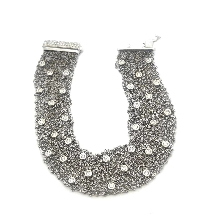 DIAMOND GOLD MESH BRACELET 18K WHITE BEZEL SET SOFT CHAIN LINK: DIAMOND GOLD MESH BRACELET 18K WHITE BEZEL SET SOFT CHAIN LINK DIAMOND GOLD MESH BRACELET 18K WHITE BEZEL SET SOFT CHAIN LINK This beautiful bracelet is crafted from 18k white gold featuring a 20mm wi