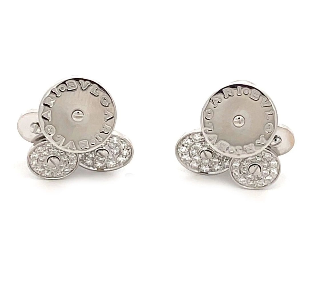 BVLGARI CICLADI DIAMOND 18K WHITE GOLD 3 DISCS HUGGIE EARRINGS: BVLGARI CICLADI DIAMOND 18K WHITE GOLD 3 DISCS HUGGIE EARRINGS BVLGARI CICLADI DIAMOND 18K WHITE GOLD 3 DISCS HUGGIE EARRINGS By Bvlgari from their Ciciladi Collection, this gorgeous authentic pair of