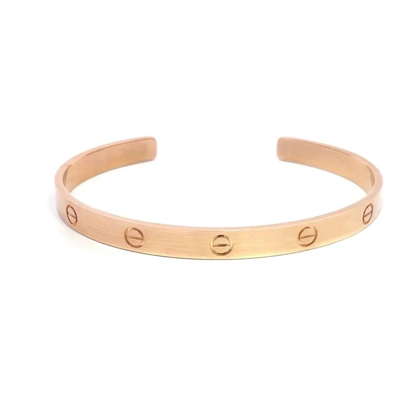 CARTIER LOVE CUFF BRACELET 18K ROSE GOLD SCREW MOTIFS SIZE 21 POCH PAPER: CARTIER LOVE CUFF BRACELET 18K ROSE GOLD SCREW MOTIFS SIZE 21 POCH PAPER This popular bracelet is by Cartier from the Love Collection; it is a luxurious piece of fine jewelry crafted from 18k rose gol