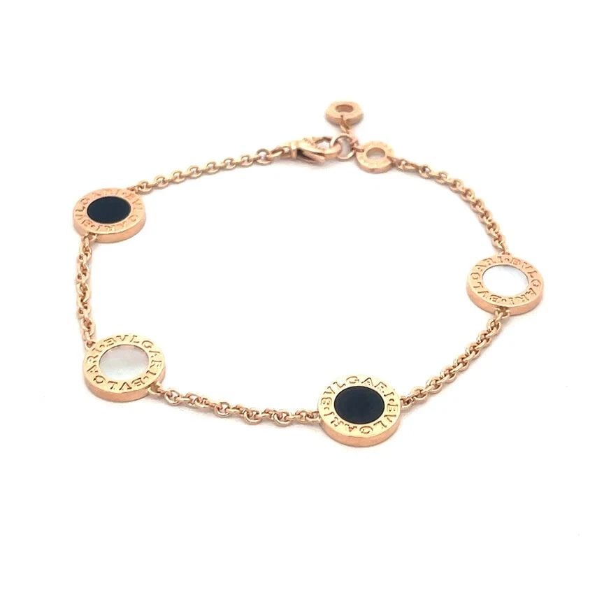 BULGARI ROSE GOLD 4 DISC BRACELET 18K ENGRAVED BEZEL CHAIN: BULGARI ROSE GOLD 4 DISC BRACELET 18K ENGRAVED BEZEL CHAIN BULGARI ROSE GOLD 4 DISC BRACELET 18K ENGRAVED BEZEL CHAIN Elegant and authentic by Bulgari, this 4 disc motif bracelet is crafted from 18k r