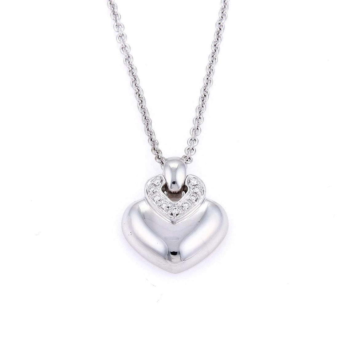 BULGARI DIAMOND GOLD NECKLACE 18K WHITE PUFFED HEART PENDANT: BULGARI DIAMOND GOLD NECKLACE 18K WHITE PUFFED HEART PENDANT This is a lovely authentic heart pendant and chain necklace from Bulgari, well-crafted from 18k white gold with a high polished finish. The