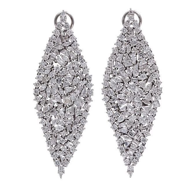 18KT 15CT RARE FANCY TRILLION BAGUETTE DIAMOND EARRINGS: 18KT 15CT RARE FANCY TRILLION BAGUETTE DIAMOND EARRINGS The Following Items we are offering is a Rare Important Radiant 18KT White Gold Gorgeous Glittering Diamond Earrings. Each Piece Features Diamon