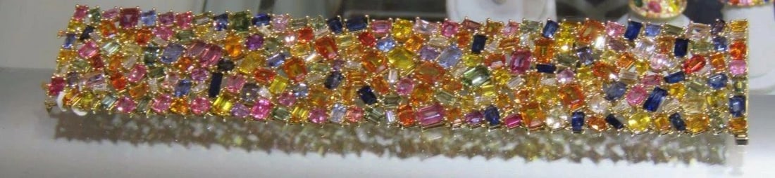 18KT RARE FANCY MULTI RAINBOW SAPPHIRE DIAMOND BRACELET: 18KT RARE FANCY MULTI RAINBOW SAPPHIRE DIAMOND BRACELET The Following Items we are offering is a Rare Important Radiant 18KT Gold Large Fancy Multi Colored Sapphire Diamond Bracelet. Bracelet is