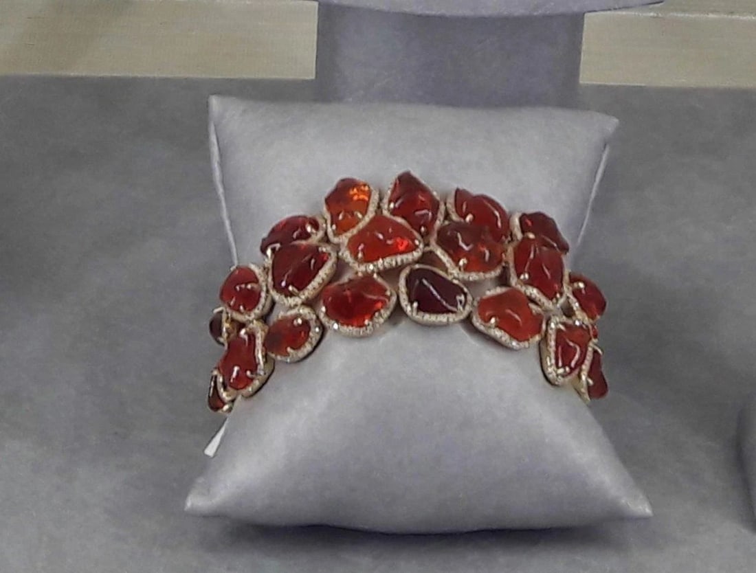 18KT GOLD RARE MAGNIFICENT 80CT FIRE OPAL DIAMOND BRACELET: 18KT GOLD RARE MAGNIFICENT 80CT FIRE OPAL DIAMOND BRACELET The Following Items we are offering is this Rare Important Radiant 18KT Gold Large Fancy Mexican Fire Opal Diamond Bracelet. Bracelet is comp