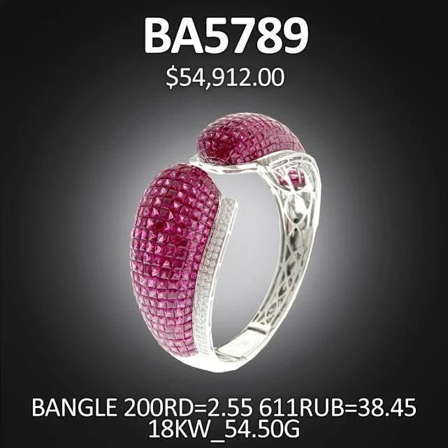18KT LARGE 41CT RUBY DIAMOND CUFF BANGLE: 18KT LARGE 41CT RUBY DIAMOND CUFF BANGLE 18KT LARGE 41CT RUBY DIAMOND CUFF BANGLE The Following Item we are offering is this Beautiful Rare Important 18KT White Gold Ruby and Diamond Cuff Bangle. Bang