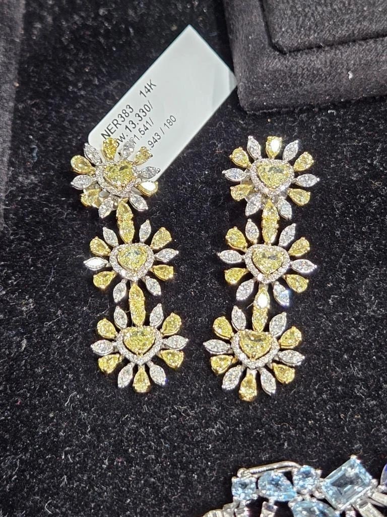 GLITTERING LRG FANCY YELLOW DIAMOND HEART DANGLE EARRINGS: GLITTERING LRG FANCY YELLOW DIAMOND HEART DANGLE EARRINGS The Following Item we are offering is this Beautiful Rare Important Gold Large Glittering Heart Diamond Dangle Earrings. Earrings are