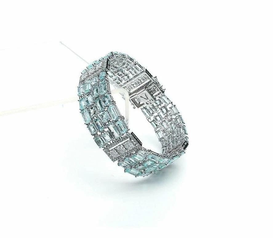 18KT GOLD 27CT PARAIBA TOURMALINE DIAMOND BRACELET: 18KT GOLD 27CT PARAIBA TOURMALINE DIAMOND BRACELET The Following Items we are offering is a Rare Important Gorgeous 18KT White Gold Winston Style Glistening Paraiba Tourmaline and Diamond Bracelet