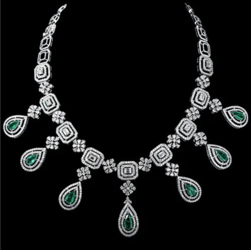 18KT GOLD EMERALD DIAMOND NECKLACE: 18KT GOLD EMERALD DIAMOND NECKLACE A Rare White Gold Emerald Fringe Diamond Necklace. Necklace is comprised of Finely Set Glittering Gorgeous Emeralds and Diamonds