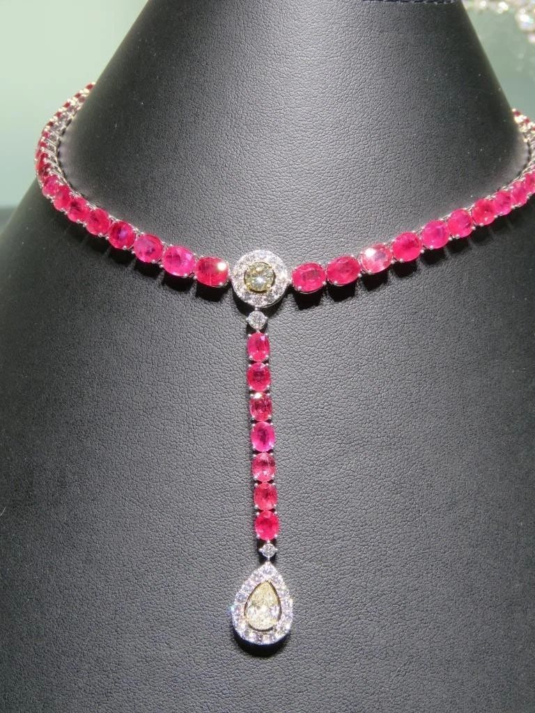 18KT GOLD GORGEOUS GLITTERING RUBY DIAMOND DROP NECKLACE: 18KT GOLD GORGEOUS GLITTERING RUBY DIAMOND DROP NECKLACE The Following Item we are offering is this Rare Important Radiant 18KT Gold Gorgeous Glittering and Sparkling Magnificent Fancy Ruby and Diamon