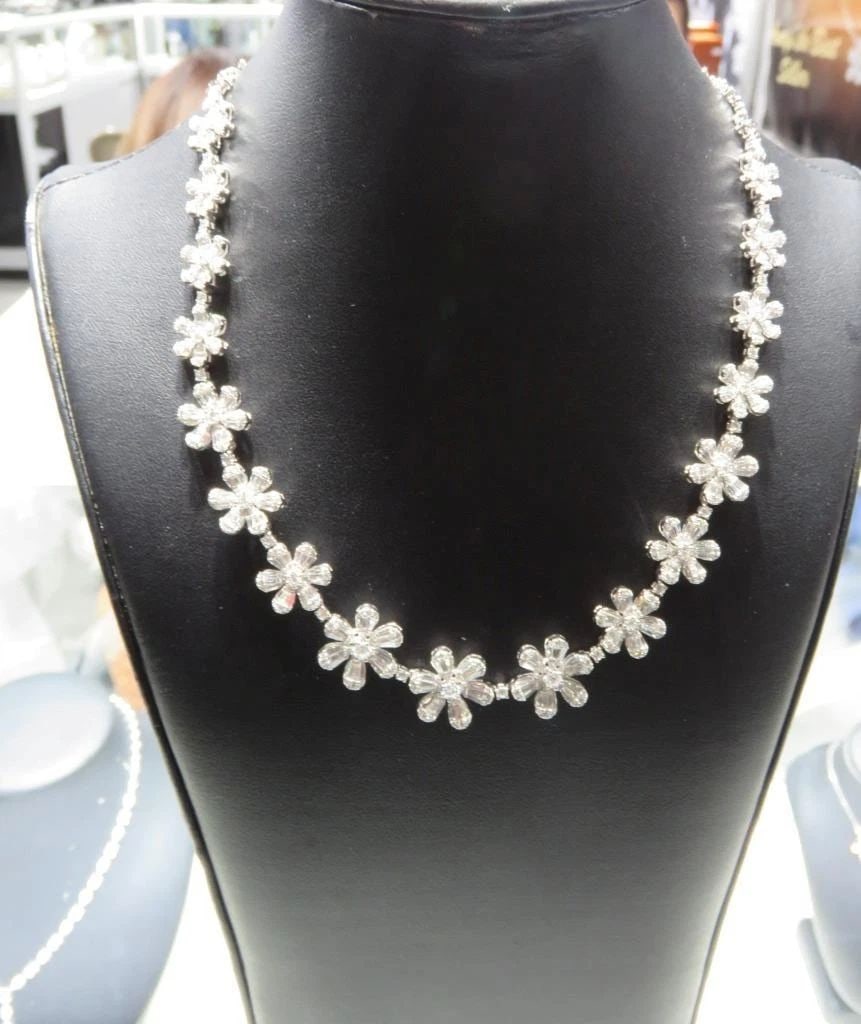 18KT GOLD FANCY GLITTERING 8.50CT FLOWER DIAMOND NECKLACE: Description LAST CALL, LAST CHANCE!!! LIQUIDATION SALE!!! The Following Item we are offering is a Rare 18KT White Gold Multi Flower Diamond Strand Necklace. Necklace is comprised of Finely Set Gorgeou